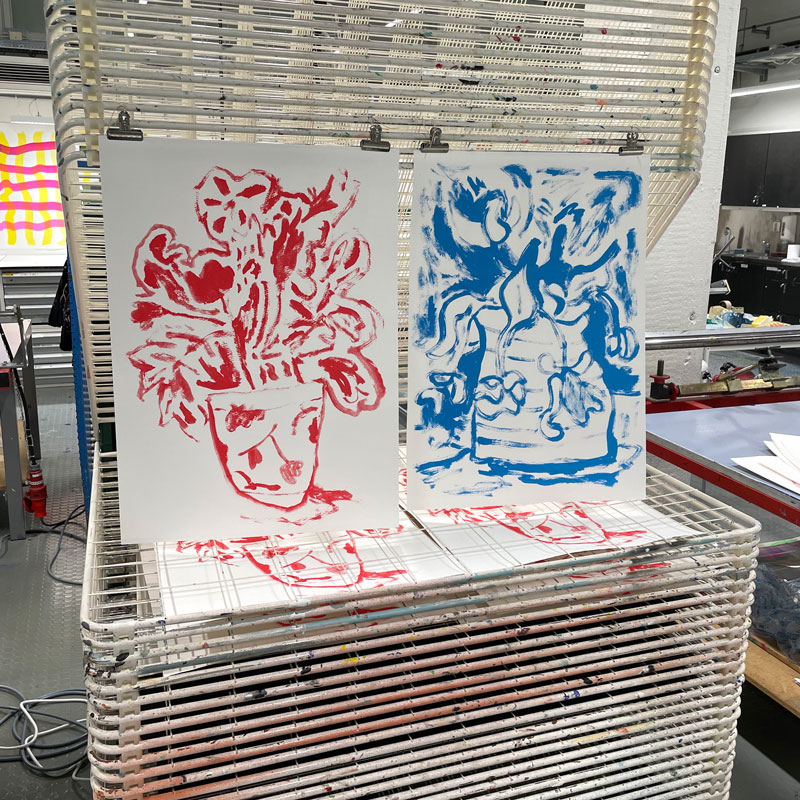 Serigraphs drying after being printed