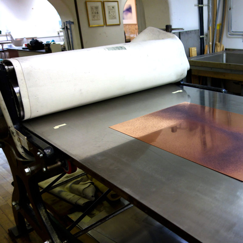 Essential parts of the printing process: printing press, paper and a copper plate